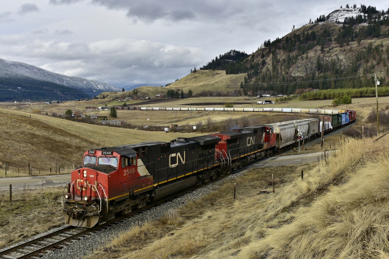 CN nos.2549 & 2557 have reached mile 63.3 on the Okanagan sub and are heading south with today's load of empties.