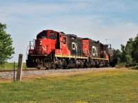 CN 7081 and 7046 have a handful of cars in tow as they head around the curve at Pelton and onto the former C&O on their way to switch Essex Hybrid - a trans-loading facility - on Windsor's east end. The place has expanded quite a bit over the past couple of years, extending two sidings this summer with more expansion to come.