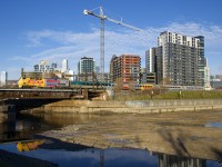 Up until a recent timetable change VIA 63 has always been composed of all or nearly all stainless steel cars, but it now sometimes sports a consist of four LRC cars, as shown here, with VIA 914 leading the train past Wellington Tower in Montreal.