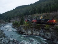 A northbound on CN's former BCR mainline grinds northward, fighting against gravity as the Cheakamus River roars in the opposite direction. 