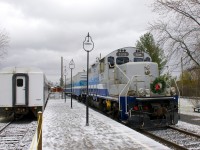 Exporail's Christmas Train (with a rare all-AMT consist of GP9 AMT 1311, generator car AMT 603 and coach AMT 827) approaches Hays Station to pick up another round of passengers. At left is coach AMT 1101.