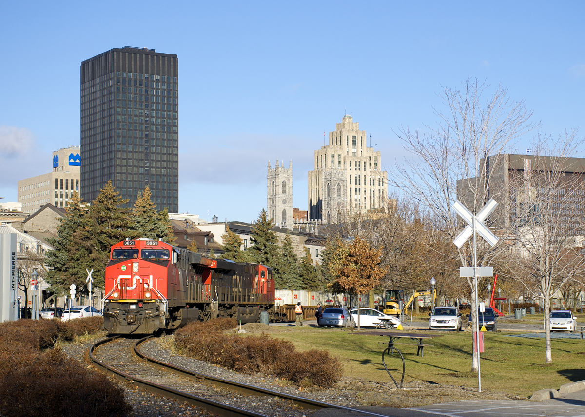 CP 3051 and CN 2927 lead a 12,227 foot long CN 149 out of the Port of Montreal.