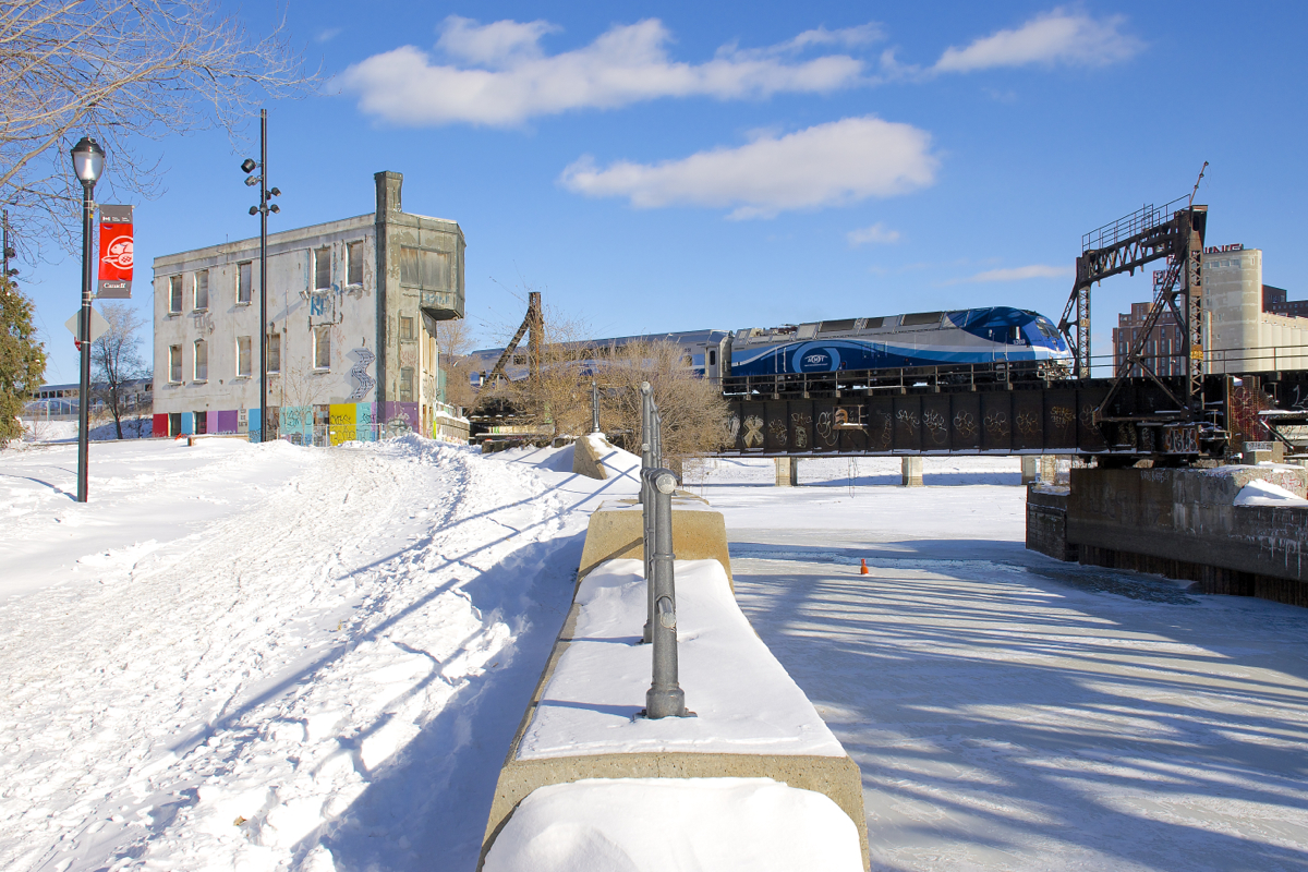 AMT 808 crosses the Lachine Canal a bit south of downtown Montreal on a sunny but frigid day, bound for Mont-St-Hilaire.