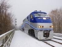 AMT 1330 leads AMT 78 towards its first stop on the island of Montreal at Lasalle station on a snowy morning.