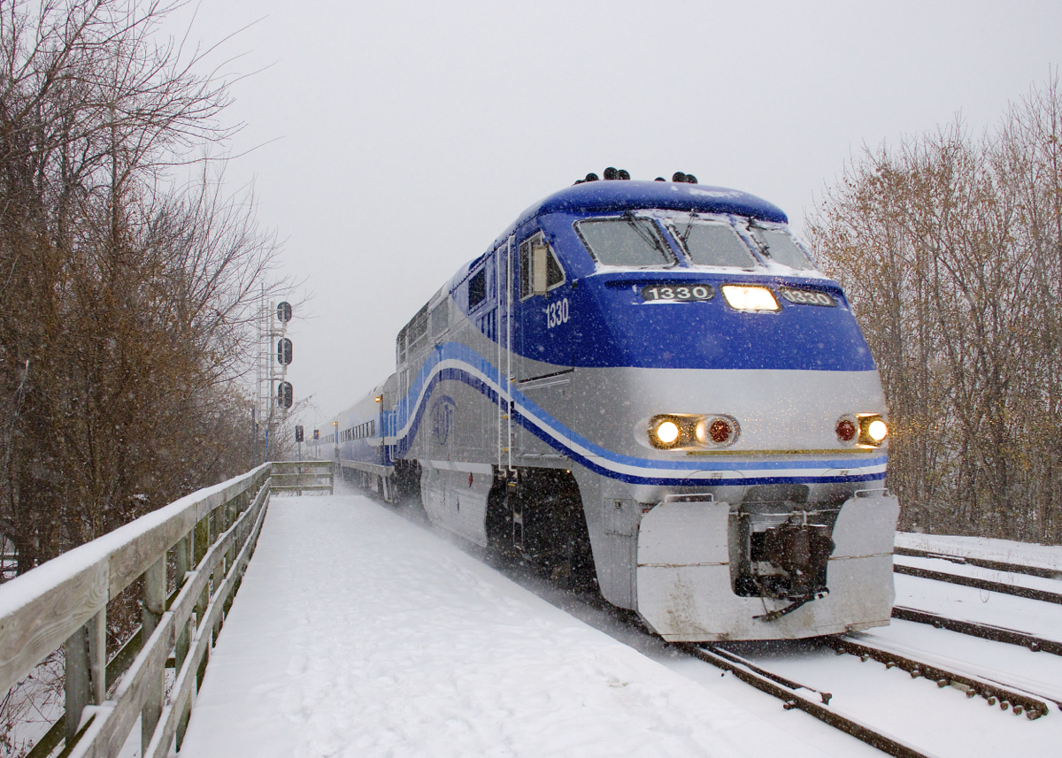 AMT 1330 leads AMT 78 towards its first stop on the island of Montreal at Lasalle station on a snowy morning.