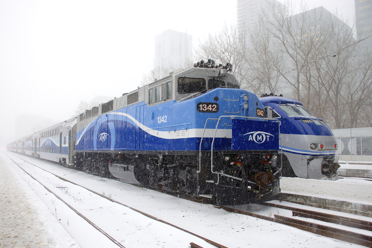 F59PH AMT 1342 and F59PHI AMT 1320 are at Lucien L'Allier Station in downtown Montreal on a snowy morning.