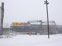 Canada 150-wrapped unit VIA 6416 is leading a late VIA 60 towards Wellington Tower during a big snowstorm in Montreal.