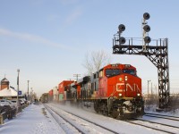 Normally passing through here at about 6-7 in the morning, a late CN 120 is passing through Dorval Station at 0920 with ES44AC's CN 2975 & CN 2880 for power. At left making its station stop is VIA 63.