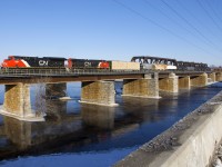 CN 3091 & CN 2952 lead CN 369 off the island of Montreal and over the Ottawa River on a cold but clear morning. 