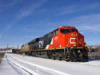 CN 310 is rounding a curve in the St-Henri neighbourhood of Montreal with two good looking ES44AC's for power on a sunny Christmas Eve morning. Leading is nearly brand new CN 2993 and trailing is leased unit CREX 1518. A few minutes later CN 120 (which is the train I was expecting to shoot) would pass on the north track.