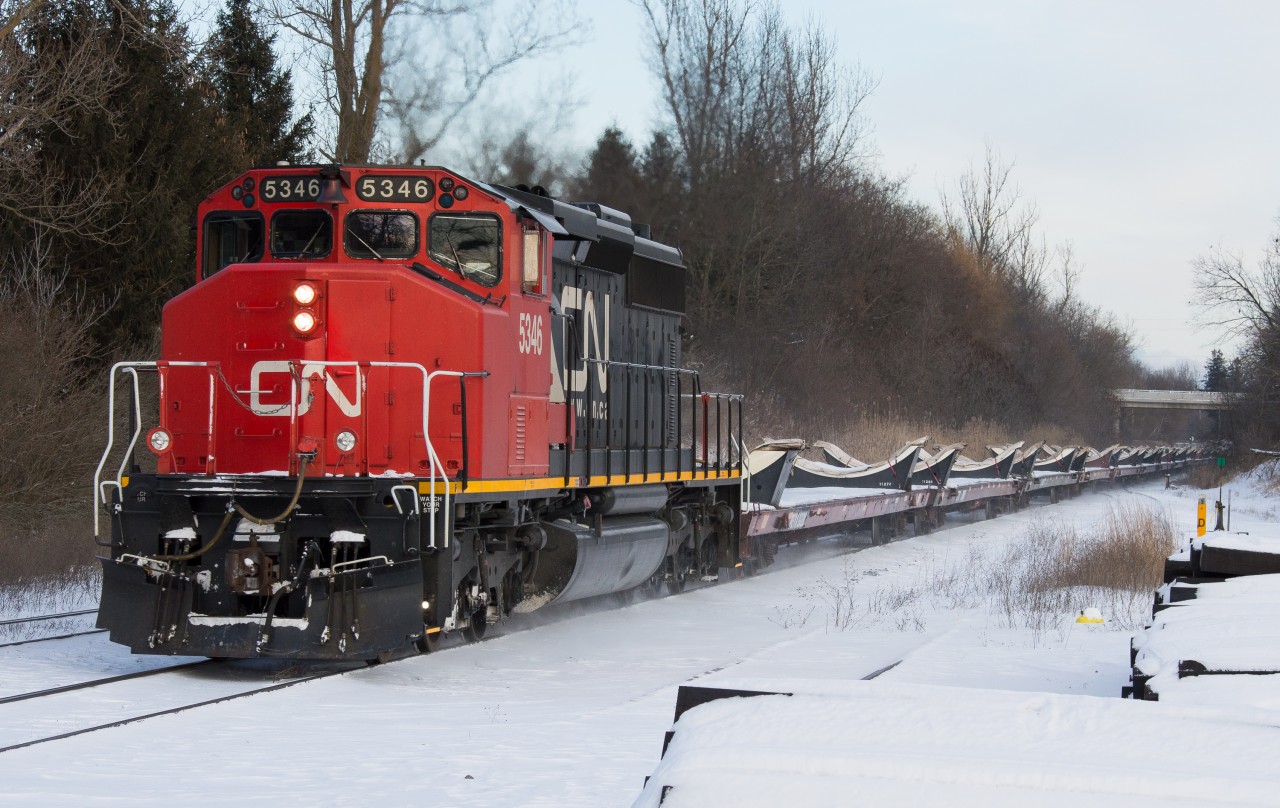 CN 5346 leads train L315 up the grade at Copetown with empty wind turbine blades on a frigid boxing day afternoon.