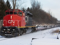 CN 5346 leads train L315 up the grade at Copetown with empty wind turbine blades on a frigid boxing day afternoon.