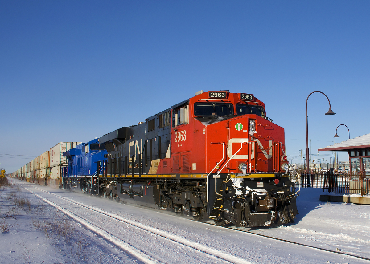 Nearly finished its long journey from the West Coast of Canada, CN 108 passes through Dorval with Canada-only CN 2963 and lease unit GECX 2035 (though it sounds like CN may have actually bought this unit) on a cold but sunny morning.