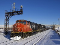 CN 585 passes through Dorval with 62 cars, including 34 TankTrain cars at the rear. Power is CN 9531, a 1975-built GP40-2L(W), with NS 7298 trailing. This latter unit was built as an SD9043MAC for Union Pacific in 1996 as UP 8070, later being renumbered to UP 3532. Norfolk Southern bought it from UP in 2014 and rebuilt it to an SD70ACu in 2016.