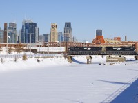 CN 528 is crossing the Lachine Canal with the skyline of downtown Montreal in the background on a truly frigid day. Power is two recently rebuilt units: NS 4058 and NS 7298. NS 4058 is an AC44C6M that was originally C40-9 NS 8800. NS 7298 was built as an SD9043MAC for Union Pacific in 1996 as UP 8070, later being renumbered to UP 3532. Norfolk Southern bought it from UP in 2014 and rebuilt it to an SD70ACu in 2016.