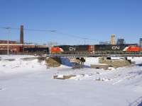 EMD's CN 5608 & CN 5707 lead CN 310 over the partially drained Lachine Canal in Montreal.