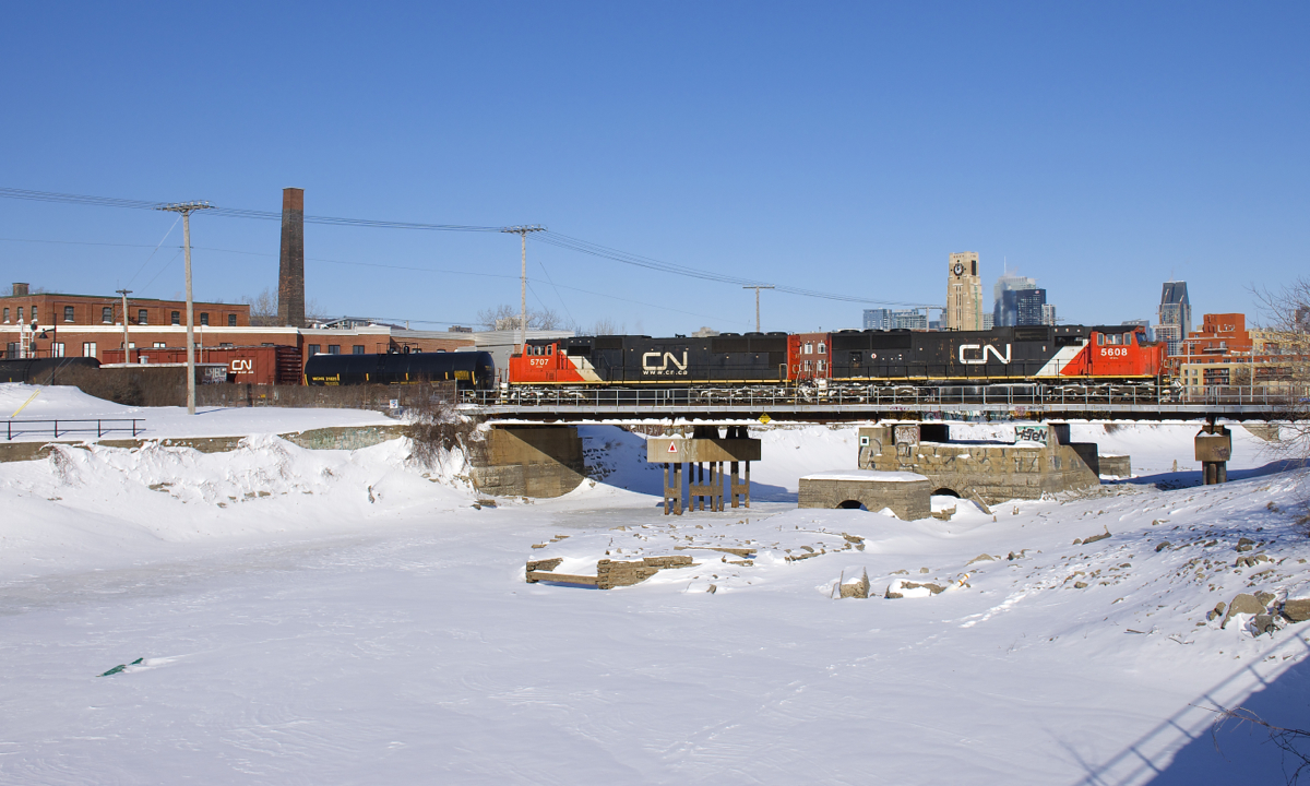 EMD's CN 5608 & CN 5707 lead CN 310 over the partially drained Lachine Canal in Montreal.