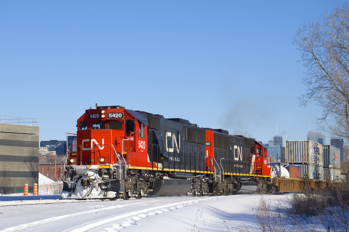 On the last day of the year CN 149 has a pair of SD60's (CN 5420 & CN 5440) as it passes the Turcot Holding Spur at MP 4 of the Montreal Sub. Barely visible above the containers is the skyline of downtown Montreal.