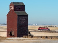 "Use Pool Co-Op Flour" read's pool elevator 587 at Whitepool. This elevator was at one point a long, long time ago served by a GTP (later CN) rail line that paralleled CP through the area. In the background CP 3006 and 3013 roll past at a leisurely 10MPH. 