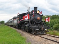 Celebrating Canada's Sesquicentennial Canada Day ... trackside and part of the Rails & Tales Canada150 Steam Excursion / Program put on by the Alberta Prairie Railway. Canada Day 2017 started off at 7:00 a.m. sharp with a double header steam excursion (APST 41 & ARM 1392) from Stettler to Big Valley and return (12:00). Guests were treated to champagne and orange juice on the train enroute and a full buffet style pancake breakfast upon arrival in Big Valley. Both steamers were decked out in flags and colours to celebrate this special day and year. APST 41, with flags a flying and under full steam, was the sole motive power for Canada Day Special #2 excursion (3:15) to Big Valley. No. 41 is a 1920 Baldwin Consolidation 2-8-0 62 feet in length and weighing 244,000 pounds. The balance of the afternoon was spent at Big Valley enjoying the interesting historic displays, exhibits (yes even 'G' scale model train locomotives) and, of course, the impressive train station/museum. The day/evening was capped off with a barbequed steak and a cool 'Canadian'. Patriotic and  memorial experience or what! Now bring on 2018!   