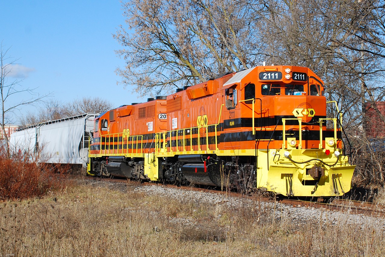 RLHH 2111 and RLHH 2081 make a fine looking pair as they lead 2 cars to Ingenia, passing by what was once TH&B's Newport Yard in Brantford, ON.