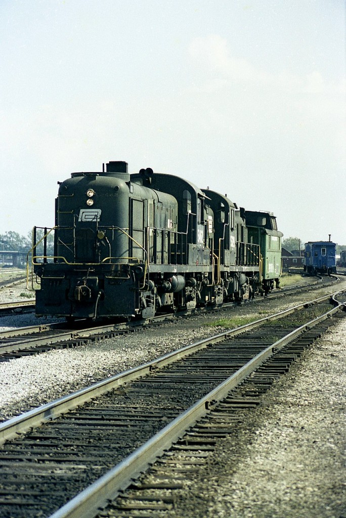 Not the greatest shot by any means, but it IS a pair of Penn Central RS-3s, something I had not seen in Fort Erie before. Don't even recall seeing them in Buffalo.  Anyway, it is a shame it is hard to place this shot, but it is away from the CN diesel shop; you can see CR caboose back there as well and on the left hand side you can make out the Central Av bridge.  It was a quick shot because just as quickly I was going to get myself ushered out of the area. Just could not resist this power.............. Units are 5462 and 5329.