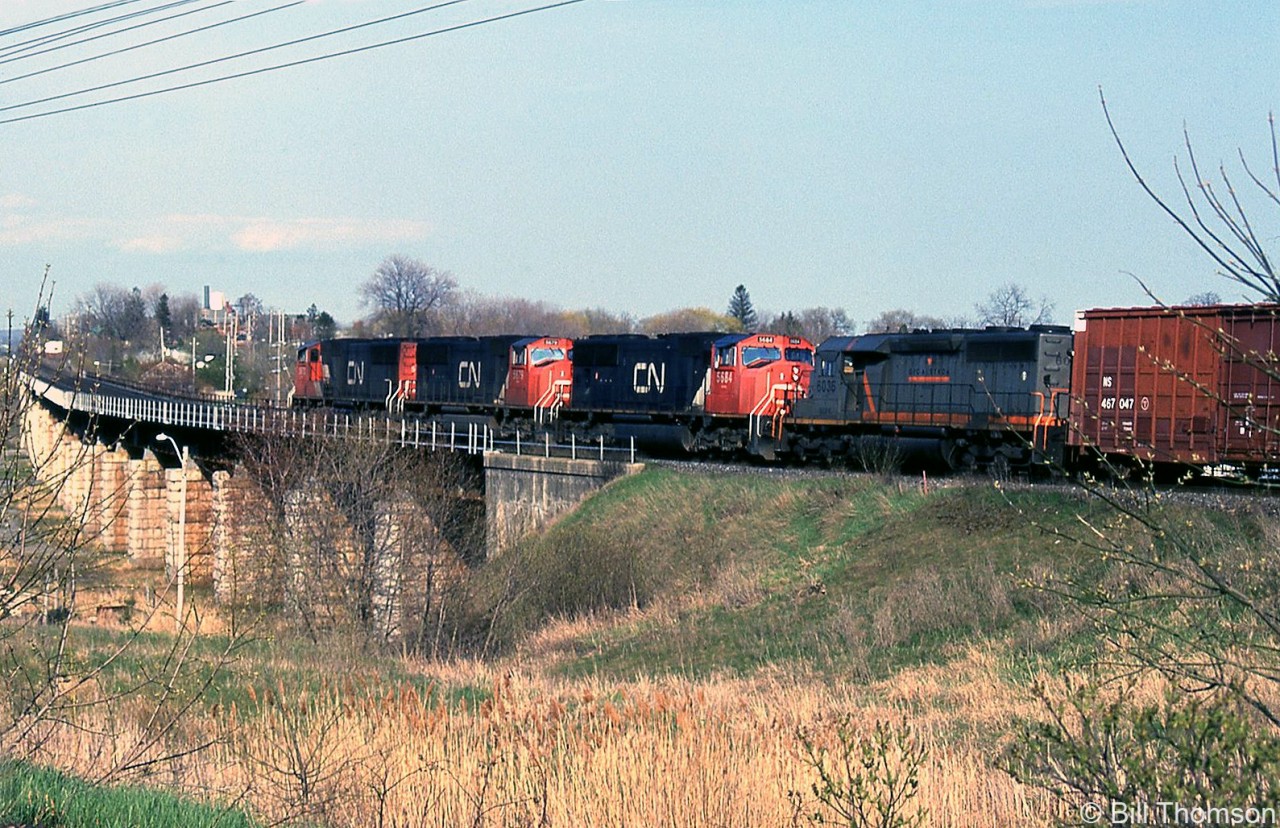 Rebuilt GCFX SD40-3 6036 trails a trio of CN SD75I's on an eastbound freight begins over Port Hope Viaduct (1232 feet long), at Mile 270.5 CN Kingston Sub.