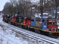 M38531 17 with CN 2518, CN 8017, CN 2114, and GTW 5831 start through the "S" curve at John Ave, as they're headed to make a 20 car lift at Paris West