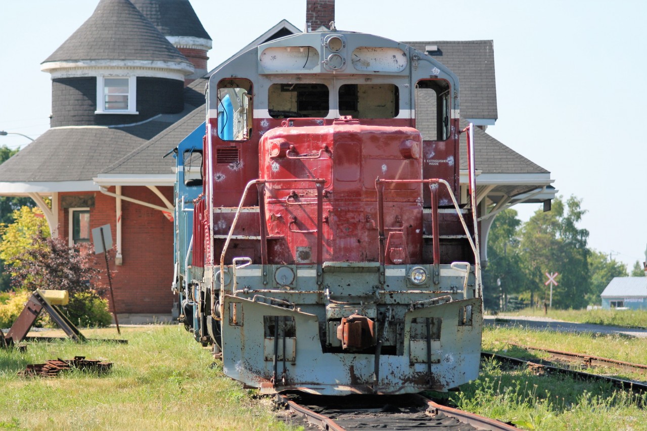On a hot summer afternoon, the shell of retired Goderich-Exeter Railway (GEXR) GP9 901 and GP35m 3834 bask in the sun beside the former CN Goderich, Ontario station on June 25, 2007. Both units would eventually be scrapped at Goderich along with several others in the years that followed.