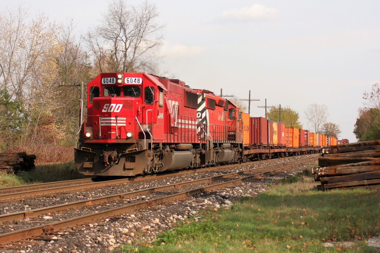A westbound CP train led by SOO SD60 6048 and a CP SD40-2 is viewed passing the Orrs Lake, Ontario siding on the CP Galt Subdivision on October 29, 2007.