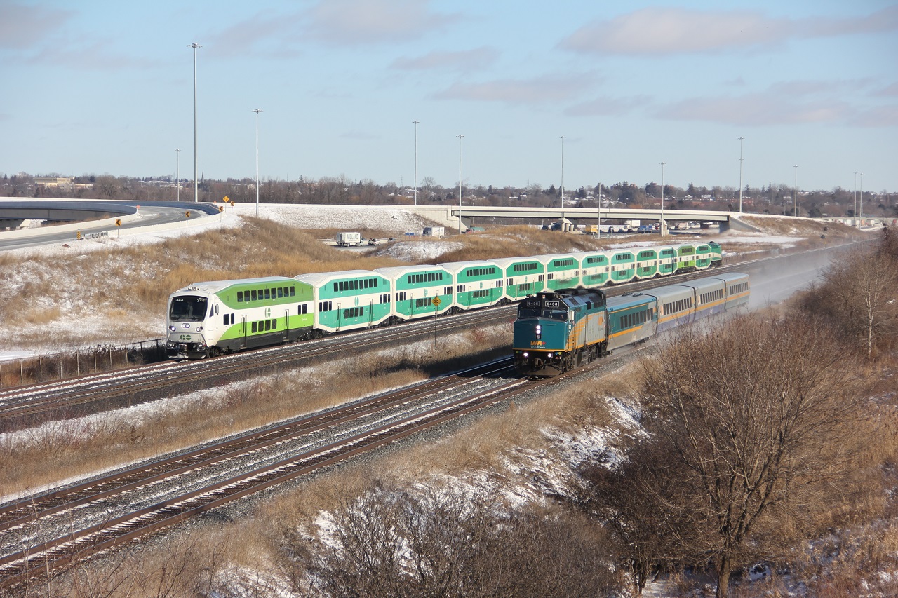 Via 51 6438 clipping along at 90 plus MPH, has no trouble leaving the west bound GO 344 in its wake.