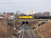A w/b ETR local heads out to Ojibway Yard to do their work for the afternoon in the industrial area in Ojibway. Here they are crossing the CASO Sub and entrance to the Detroit River Rail Tunnel which is still used by CP. 