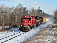 Damn it was cold, (-15C according to the detector), and windy but when you hear an SD60 leader get a clearance, you just have to wander down to the tracks and see what's up. Here, CP 6223 with NS 9058 head through Puslinch with their clearance to Ayr.