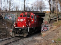 After finishing their work in the industrial area of Hamilton, a CP local returns to Kinnear Yard on the Belt Line passing under the CN Grimsby Sub. 