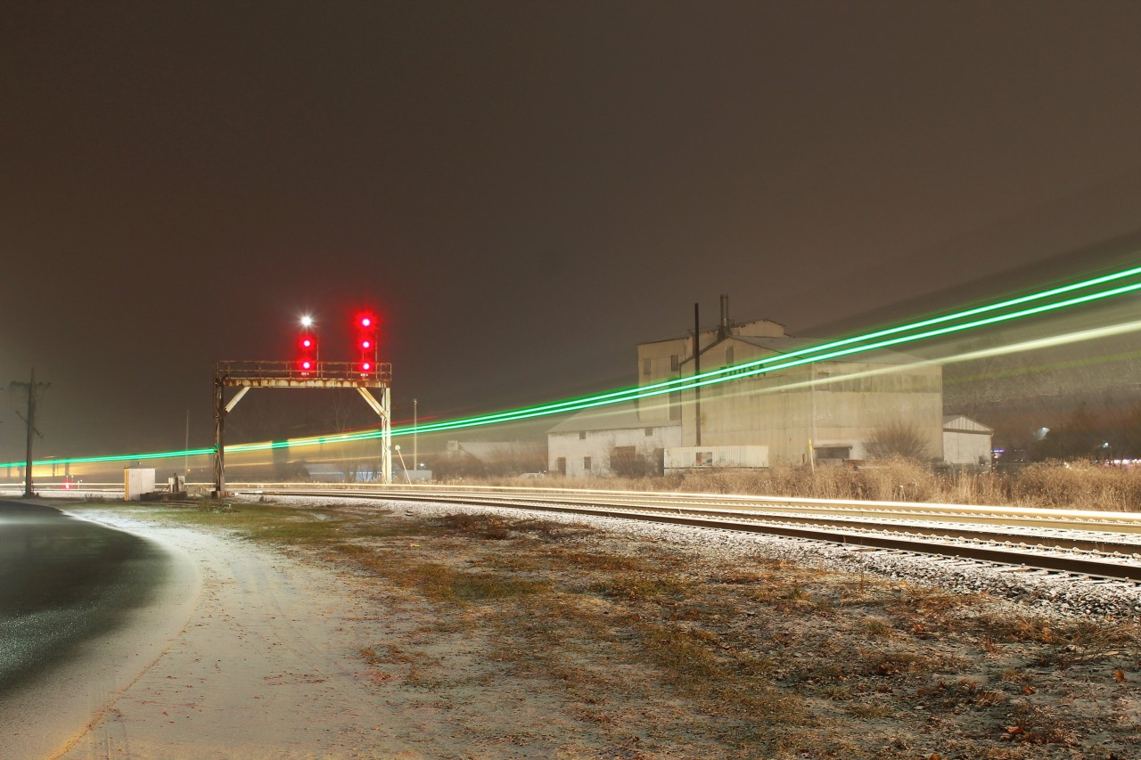 VIA 81 negotiates the curve through Paris, Ontario during an evening snowfall.