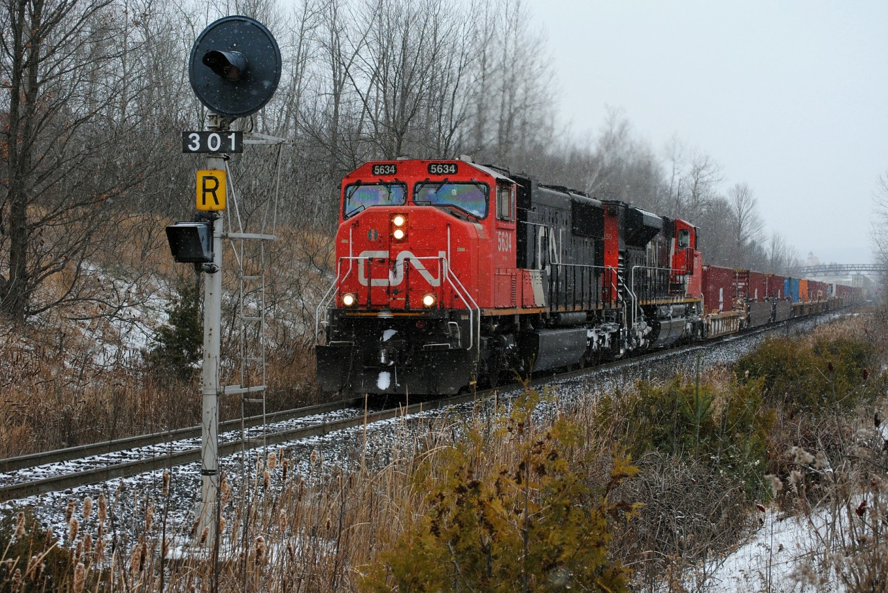 Climbing up the Halton sub at mile 30.1 is CN Q148 with a pair of EMD's pulling 444 axles of intermodals