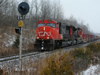 Climbing up the Halton sub at mile 30.1 is CN Q148 with a pair of EMD's pulling 444 axles of intermodals