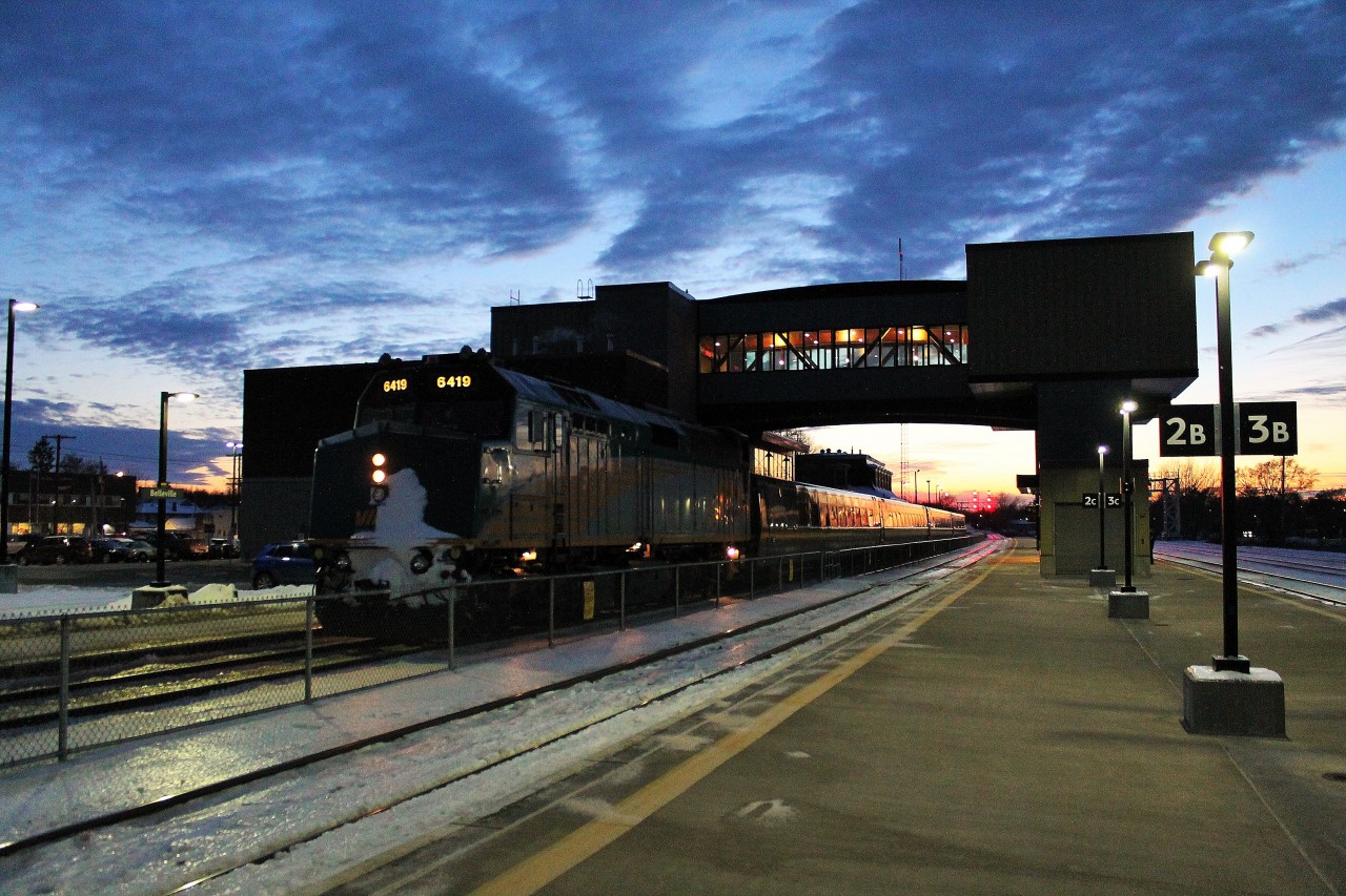 A VIA train from Toronto pauses at Belleville on its way eastward in the fading light of a winter evening.