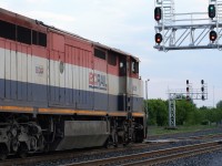 A westbound CN general merchandise train with BCOL Dash 8-40CM 4626 and CN SD75I 5773 gets the green light to depart the yard at Belleville, Ontario on a warm May evening. 