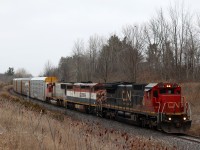 I figured that as soon as the sky turned dark and grey something cool must have been on the way. It seems lately congestion at Toronto yard has thrown the schedule of a few trains off. Lately train 385 has been running west in the mid afternoon rather then its old time slot early in the morning, and today was no exception riding hot on the tail of 397. The power was a bit more colourful today, with second hand Dash-8 2106 looking a bit festive with its DPU light lit along with BCOL 4607 with its class lights on. Leased PRLX SD75 201(ex ATSF) trails in the consist, as the train rolls through Scotch Block.