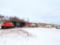 M397 rolls through Woodstock with a pair of ex-ATSF's.