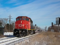 I was honestly dreading this would become a railfan paparazzi shoot, but alas it has. Lol. Though I couldn't be left out. I was aware CN 5346 had come on CN 421 on Christmas Eve day. So I kept an eye on CN during the morning to see if perhaps 5346 would be shuffled about to lead 422, being it was the only widecab available. This did not happen, and all the units except the SD40 from 421 headed back to TO with a stubby train in tow, which may have even been 524. If it was, 422 most likely did not run today. It's scary to think I've railfanned without a scanner for two years... I definitely need to invest in one again.
<br><br>
Nonetheless, the first try was unsuccessful so I monitored ATCS for a while wondering if perhaps CN 5346 had snuck through during the night somehow. And around 1pm a train was lined straight to Hamilton, myself having no clue what train it was since I don't have a working scanner. Sure enough, luck prevailed and CN 5346 was leading, an empty windmill train of all things. Past occurrences have seen these windmill flats tacked on the end of 422 or 524, rather than a dedicated 315. Today was different, perhaps having to do with the fact it was the day after Christmas. An independent widecab SD40-2W does look pretty iconic on a train, even if it is just flats. Only around 30 of these were in tow, so this was an easy job for this old soldier. L315 would take the cowpath to the Dundas Sub afterwards, heading back into the midwest states presumably for more windmill blades. I'll take this as a late Christmas gift, and am especially thankful it came in the afternoon, yielding a rare case a CN Niagara westbound freight is sunlit.
<br><br>
I chose Beamsville as the location having no idea what type of lashup to expect. It definitely appears it worked out. Beamsville is one of the more nostalgic locations for me in terms of railfanning, as it goes back for me well over a decade. I've avoided it for most part for about six years since it's a good place to draw unwanted attention from the public unfortunately. Being in the a very flat straight section, CN trains (westbounds mostly) regularly get up to 50-60mph here, which is not as easy to find in Niagara as some may think. Passenger trains still trundle along at 65mph here, though that potentially could change once Metrolinx finally gets permanent GO train service to Niagara Falls. 
<br><br>
It's interesting to note I said two years ago when I saw CN 5274 lead CN 330 that perhaps that would be the last time an SD40 is seen leading a train in Niagara. With the economy downturning, it sure looked like that statement may hold. The surge in traffic on CN recently has proved otherwise however. As our moderator had mentioned, this very well could be the last stand for strong variety on CN with the company being quite power short. Class 1's in general are quickly losing that common variety aspect. Once CN's massive order of two hundred AC GEVOs arrive, a lot of coffins will be nailed. SD40s evidently have specific advantages their higher horsepower successors lack though, as many class 1's are still avid users of them for lighter train duties despite their age. So perhaps these will once again slip past the next chopping block while their closer in age successors fade away. Though, maybe not. Regardless, there's a long stood era that's coming to an end, which is the expectation that one will be kept in suspense with variety on class 1 freight roads. One can argue that era is already over, though for what remains of it, make the most of this time before it is almost unanimously agreed upon.