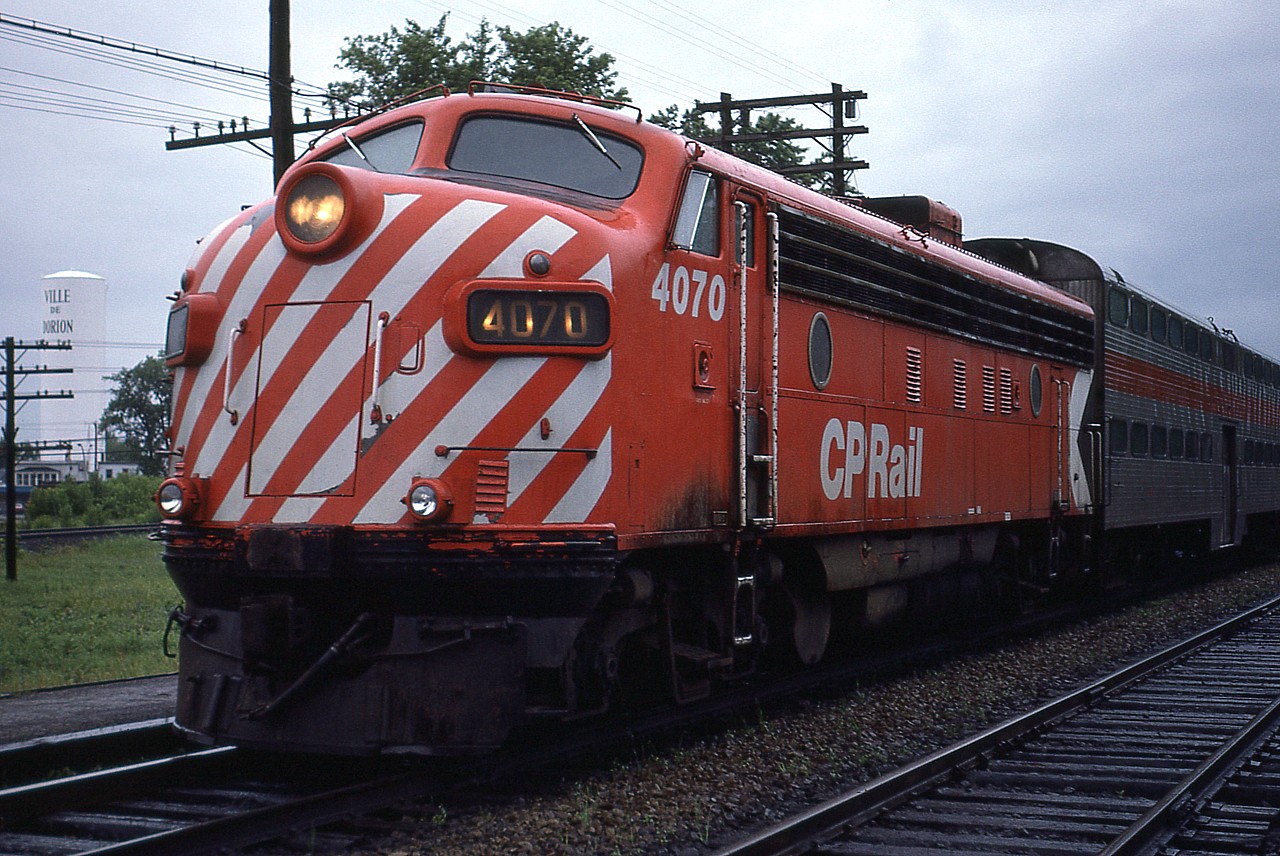 The Montreal area commuter service was using CP FP7A 4070 when I stopped at the station in Dorion-Vaudreuil back in 1981. (note the Dorion water tower as ID marker) This unit was sold to the service in 1982 and eventually became AMT 1300.