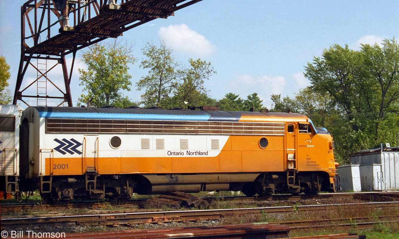 Ontario Northland FP7 2001 is the power for the Northlander on this day, pictured at Washago in 2001. Unit 2001 was one of three 1500-series GMD FP7's rebuilt with Caterpillar engines in the early/mid 90's and renumbered 2000-2002, which continued in service until retirement in the early 2000's.