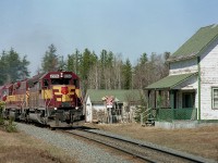WC 6506, 3012, 6655 and 6004 are rounding a slight curve passing the old Perry Sectionhouse (mile 149.9)on their way South to Sault Ste. Marie from the Sinter Plant near Wawa on the now gone Michipicoten Sub. This was the first of three southbounds seen over the day, and unfortunately I was not able to get the train number. The SectionHouse is in dire need of a coat of paint, but that is really about it.  I understand it survives still, probably a privately owned building like so many of those along the rather remote former Algoma Central line.