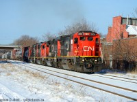 <b>As Snake would say.. Steel Steve returns </b> If this is the last train on CN I photograph in 2017 I'm good. I had no plans to go out, but with the sun full blast I got my butt out to get some Vitamin D, and a timely heads up about this movement from a Hamilton friend: CN 421 just finished work @ Hamilton Yard and is blasting off with an amazing lashup: CN 2031 (Dash 8), CN 5346 (SD40-2), CN 5471 (SD60), CN 5442 (SD60). With 200 more GEVO's coming, and the new lease fleet on the property (and still coming) - this will be the last good winter for CN - get it while you can folks. This time next year the GEVO invasion should be in full swing and CN will probably be a heck of a lot like CP in the motive power variety department. Just about everything in this lashup will likely be replaced by the GEVO invasion, unless by some miracle CN's busier than ever and can't get rid of their second hand fleet let alone the greasy ugly leasers starting to show around here. One thing is certain,  Winter 2018 is going to be worth your time on CN.<br><br>Merry Christmas everyone!