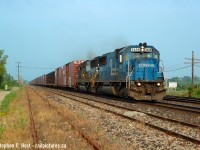 I call this the "new wedgie": Rail into corner? Check. Telegraph pole framing the shot? Check. Well, sorta.  It's quite small so it doesn't really form much of a frame, but it's there. I try not to mimic this "new wedgie" technique these days.. as it is becoming quite mundane, as is this location. However, the only things in this shot not mundane is that Conrail paint of that now retired NS SD50 in the lead, and of course, the great early morning light.  The time is 0757 and NS 327/8 made sure you got out of bed early if you wanted to shoot either of these trains and I made sure I did. While half the time NS ran with ubiquitous and boring Dash 9's in this era, when they didn't you sure paid attention.