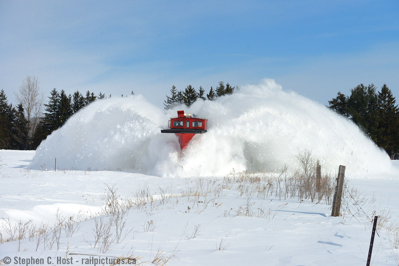 A pair of EMD F units growl in response to Gary Dagelman's heavy application of the throttle as plow CPR 401005 devours a 200 meter long, 4 foot high drift just outside of Putnam, Ontario. From my family to yours, please enjoy a Merry Christmas and a prosperous and healthy New Year. With any luck, we'll see more of this as winter 2018 bears down. Cross your fingers everyone!