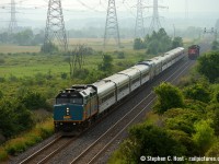 Rare Mileage for VIA Patrons as #83 and #75 combined travel over the normally freight only CNR Halton subdivision on a hazy, foggy day July 9 2013. Due to a washout on the Oakville sub VIA trains had to re-route. In the background is an aldershot-milton local servicing industries nearby and of course the hazy escarpment. We've been treated with VIA re-routes on the Halton sub about once a year ever since, plenty of time and opportunity to get this again. For the railway employees - would this train have required a CN pilot?