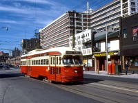 TTC PCC 4562, an A9-class car originally built for Cincinnati, operates on the Dundas route (via Church routing) coming off the curve heading southbound from Dundas Street onto Church Street. Towering in the background is the old Simpsons-Sears department store mail order building off Mutual St., still in use by Sears at the time but by the late 80's it had been sold off and is presently the "Merchandise Building" lofts. That long low building behind the streetcar has been demolished and is the present site of Ryerson's George Vari Engineering & Computing Centre building.
<br><br>
<i>Original photographer unknown, Kodachrome from Dan Dell'Unto coll.<i>